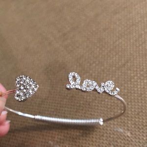 Adjustable silver “love” bracelet
